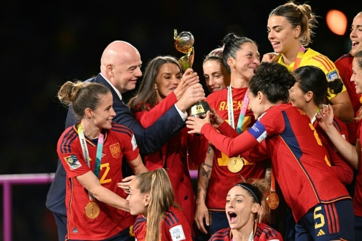 Gianni Infantino hands the 2023 Women's World Cup trophy to the Spanish team