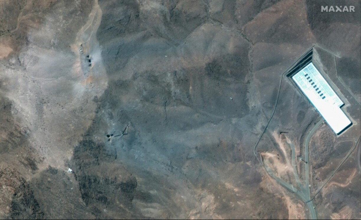 This handout satellite picture provided by Maxar Technologies and taken on June 22, 2025, shows a close-up view of craters after US strikes on Iran's Fordo Fuel Enrichment Plant (FFEP), northeast of the city of Qom