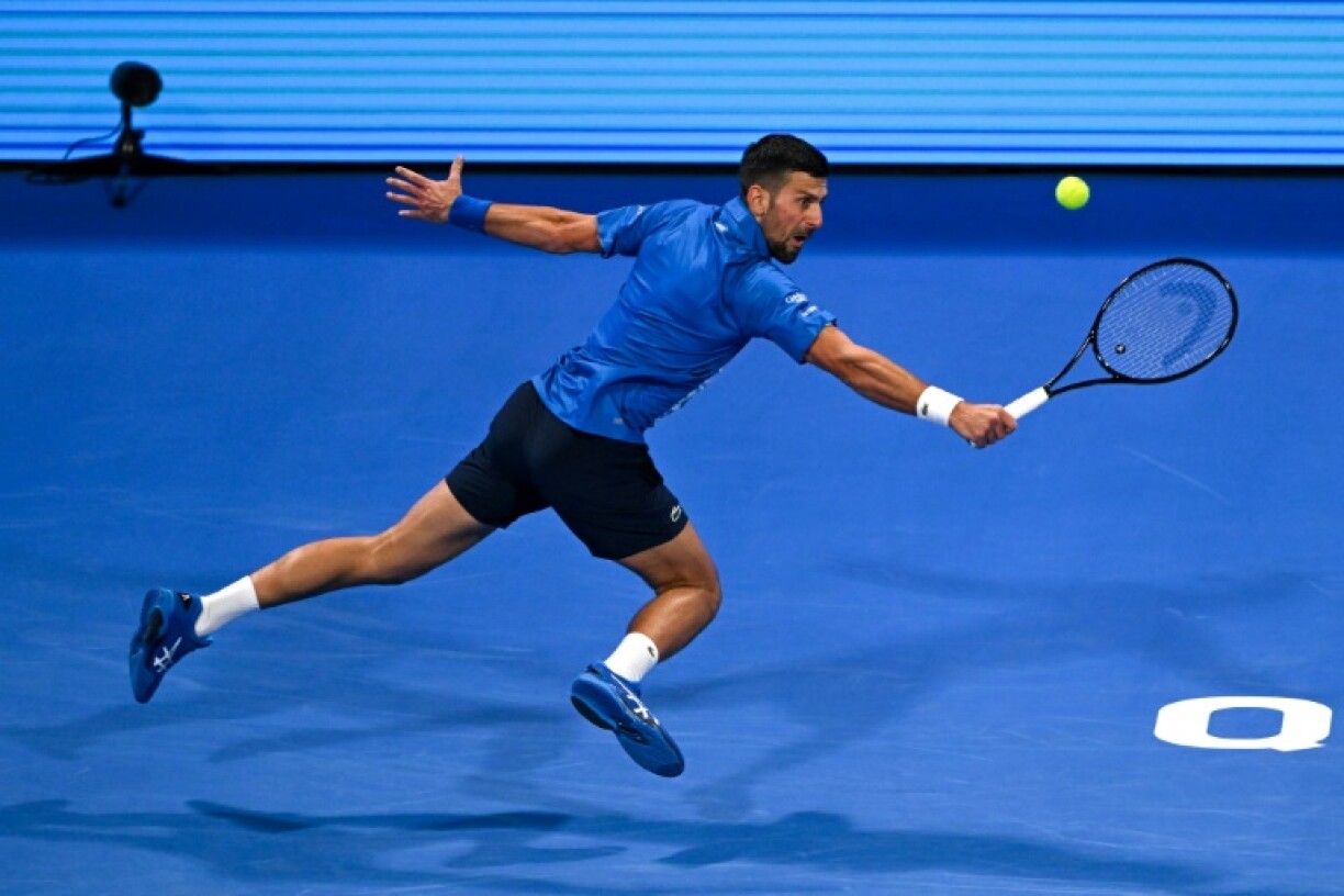 Novak Djokovic stretching for a backhand as he lost in Qatar