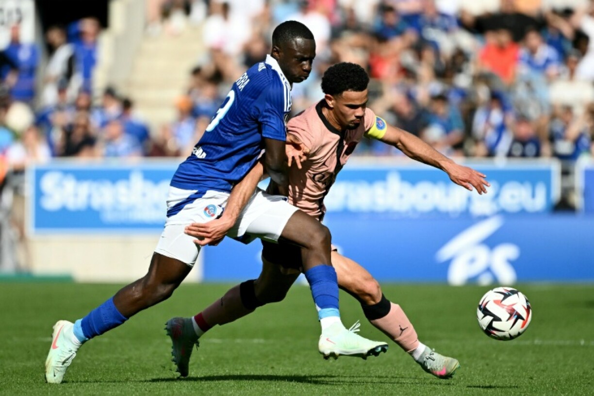Strasbourg skipper Habib Diarra challenges PSG's Warren Zaire-Emery during Saturday's Ligue 1 clash between the teams