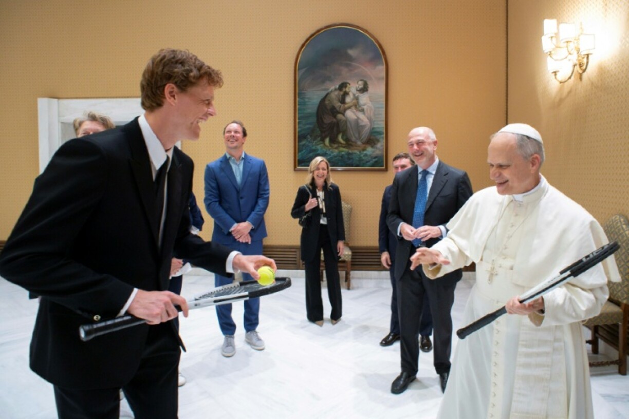 This photo taken and handout on May 14, 2025 by The Vatican Media shows Pope Leo XIV during a private audience with Italy's tennis player Jannik Sinner, in The Vatican.