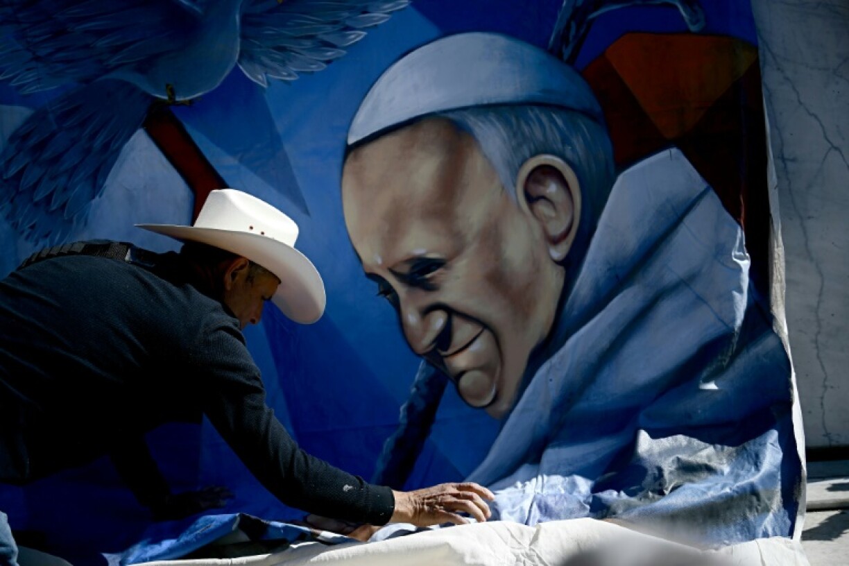 Mexican artist Roberto Marquez installed a portrait of Pope Francis outside the Rome hospital where he is being treated