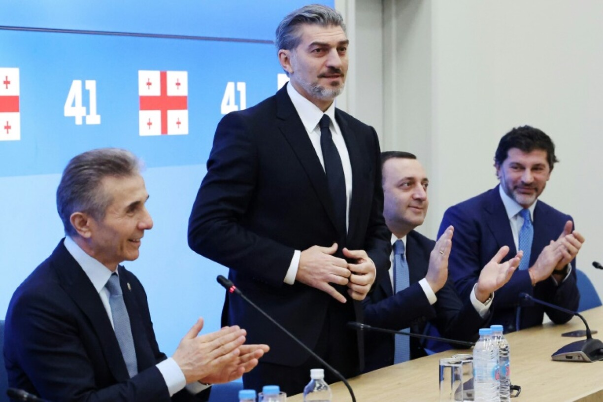 Former footballer Mikheil Kavelashvili (standing) is set to be appointed president