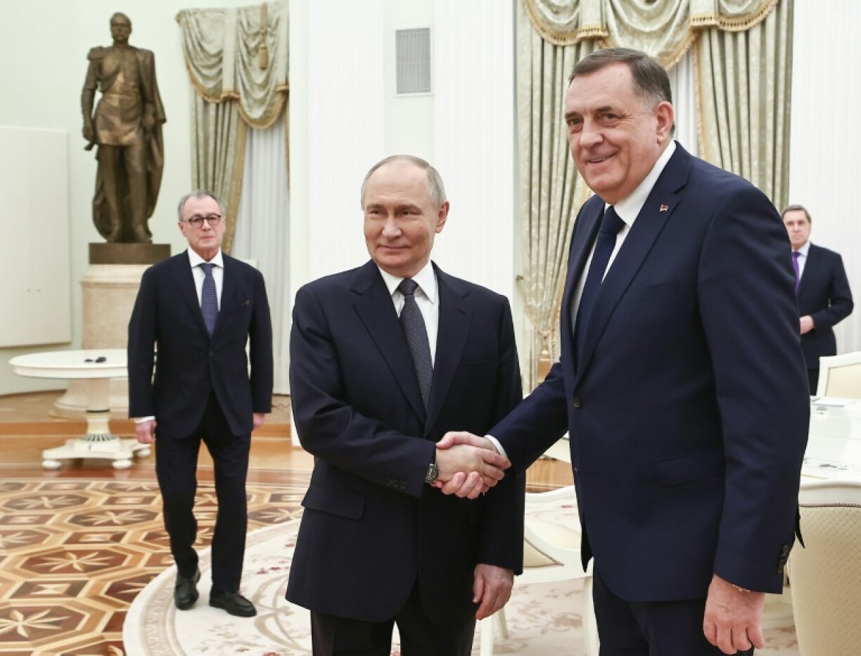 Russia's President Vladimir Putin greets wanted Bosnian Serb leader Milorad Dodik in Moscow