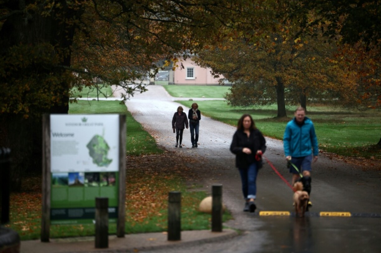 Members of public walk near the entrance to the Royal Lodge in Windsor Great Park