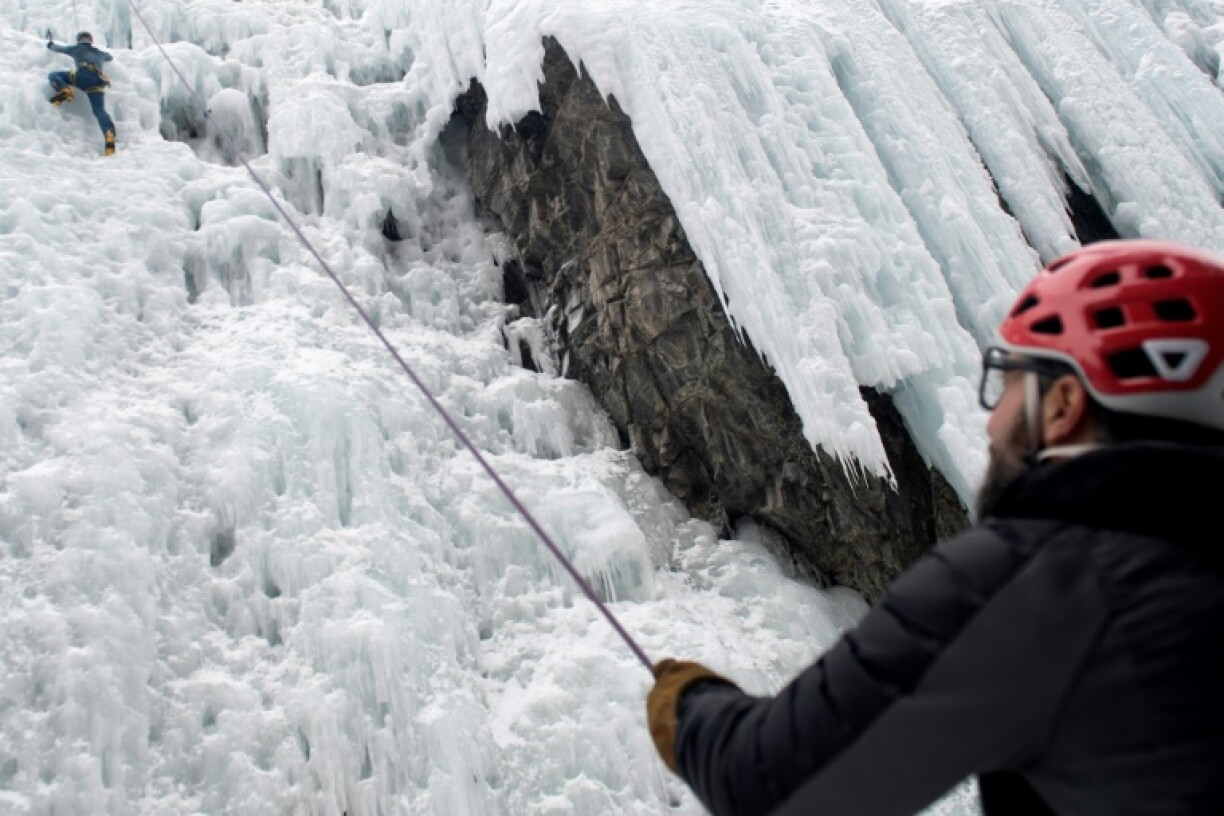 Climbers use ice axes and crampons to get up the frozen routes