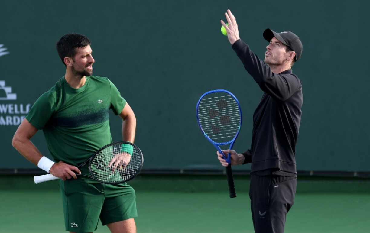 Novak Djokovic and coach Andy Murray work on the Serbian star's serve during practice prior at the Indian Wells ATP Masters