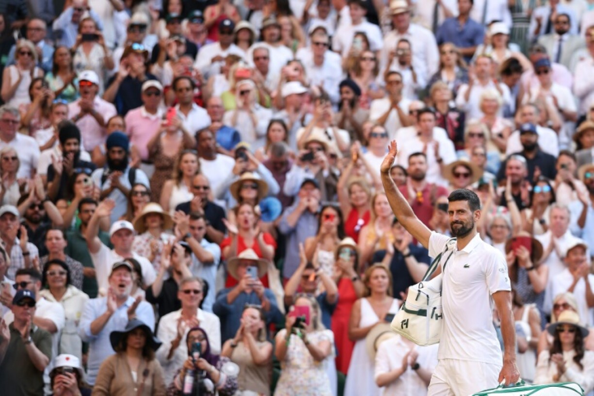 Novak Djokovic leaves the court after losing to Jannik Sinner at Wimbledon