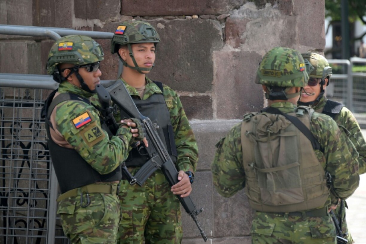 Ecuadorean Army soldiers stand guard outside of the Carondelet presidential palace in Quito on April 8, 2025.
