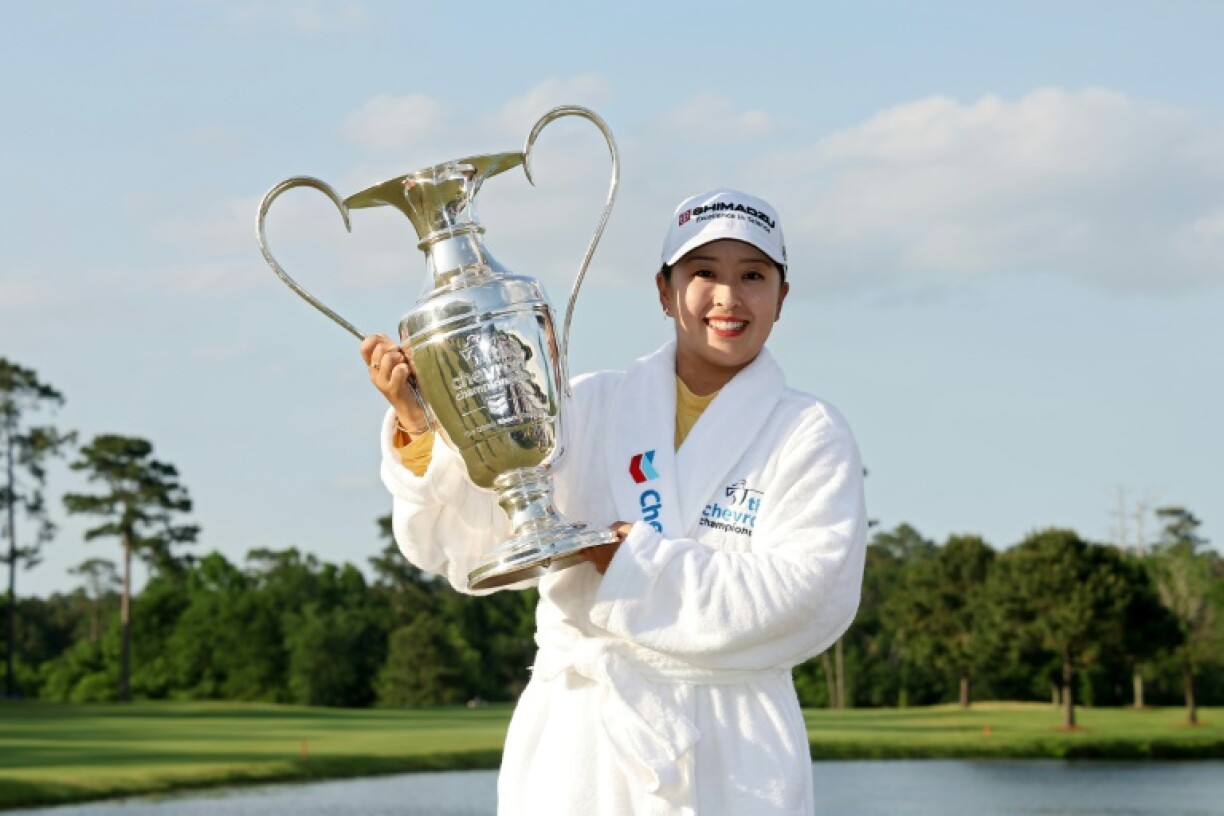 Japan's Mao Saigo holds the trophy after winning her first major title at the Chevron Championship in a playoff