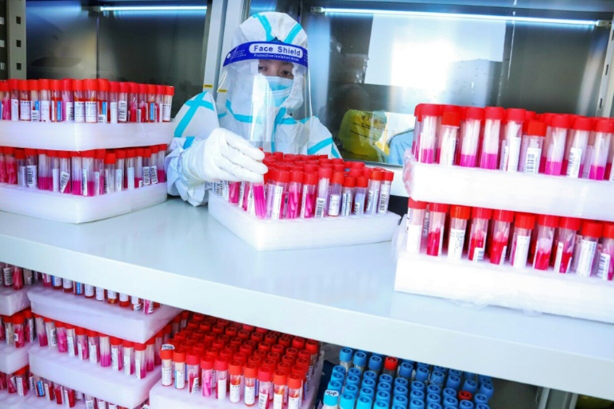 A lab technician at a temporary Covid-19 testing facility