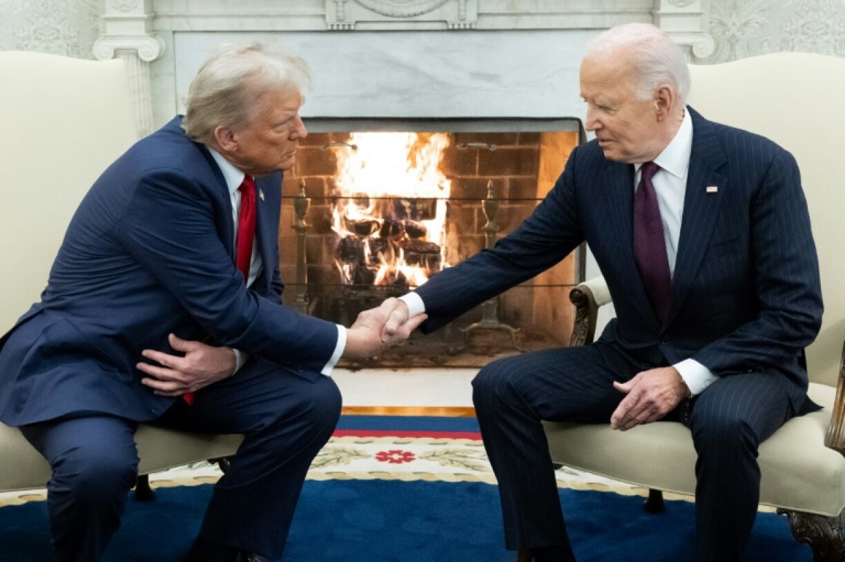 US President Joe Biden, pictured at the White House with Donald Trump in November 2024, will step down in January 2025
