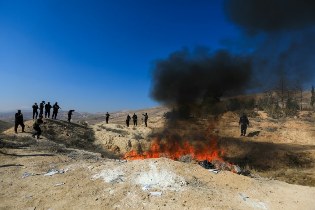 Seized captagon is burned in a field near the Fourth Division's Security Bureau on the edge of Damascus