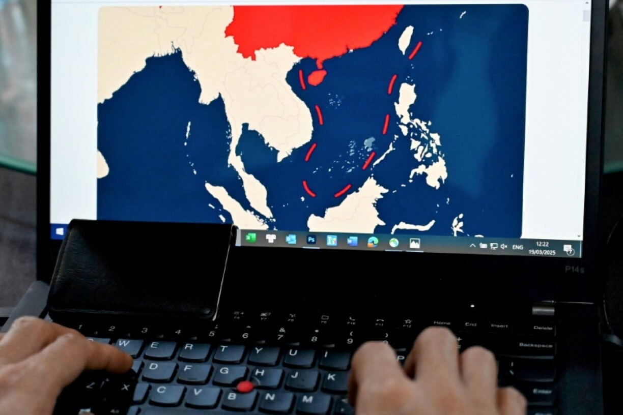 Illustration showing the nine-dash line on a map of a disputed area of the South China Sea on a laptop in Lao Cai province