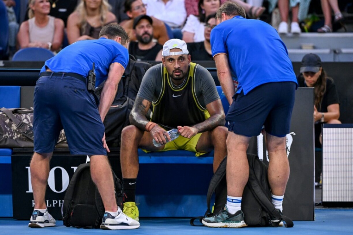 Nick Kyrgios is attended to by physios during the second set against Jacob Fearnley