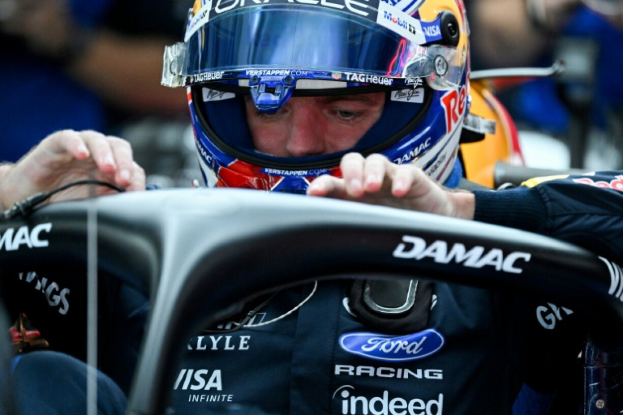 Verstappen gets into his car ahead of the second practice session ahead of the Formula One Bahrain Grand Prix in Sepang