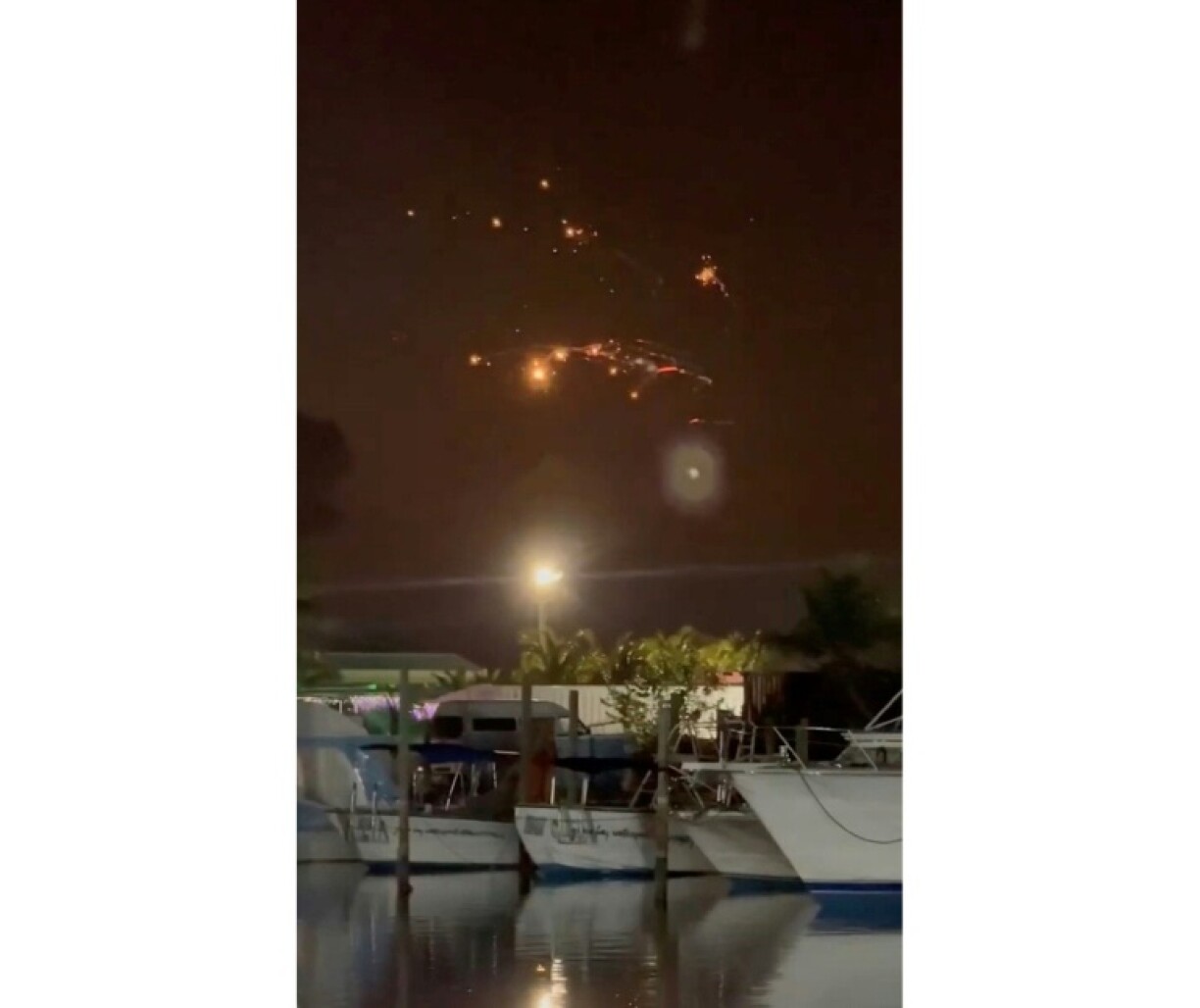 In this handout image courtesy of X user Mark O’Henly, debris from the SpaceX Starship is seen in the sky from a restaurant in Turks and Caicos