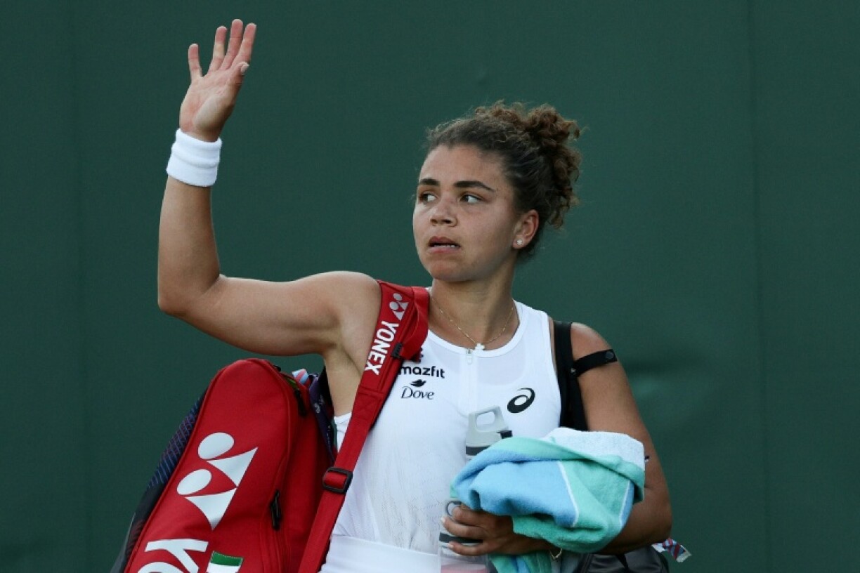 Jasmine Paolini, the Wimbledon finalist in 2024, leaves the court after losing to Russia's Kamilla Rakhimova in the second round