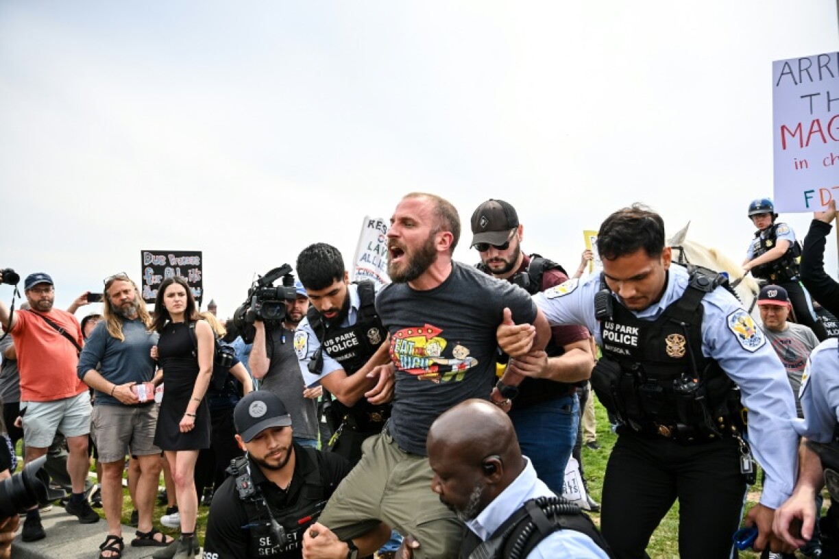 A demonstrator wearing a shirt that reads