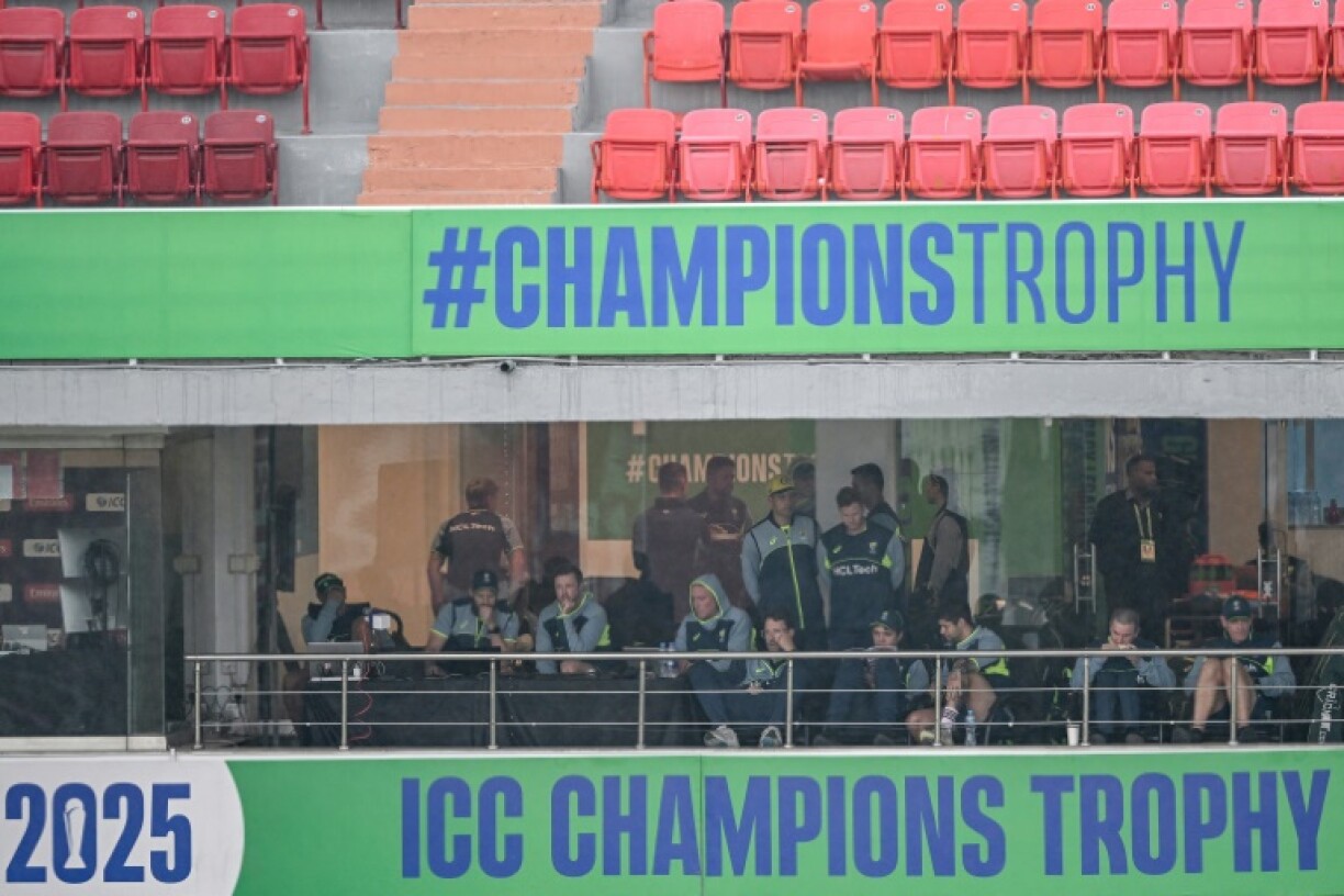 Australia players watch from their balcony as the rain comes down in Rawalpindi