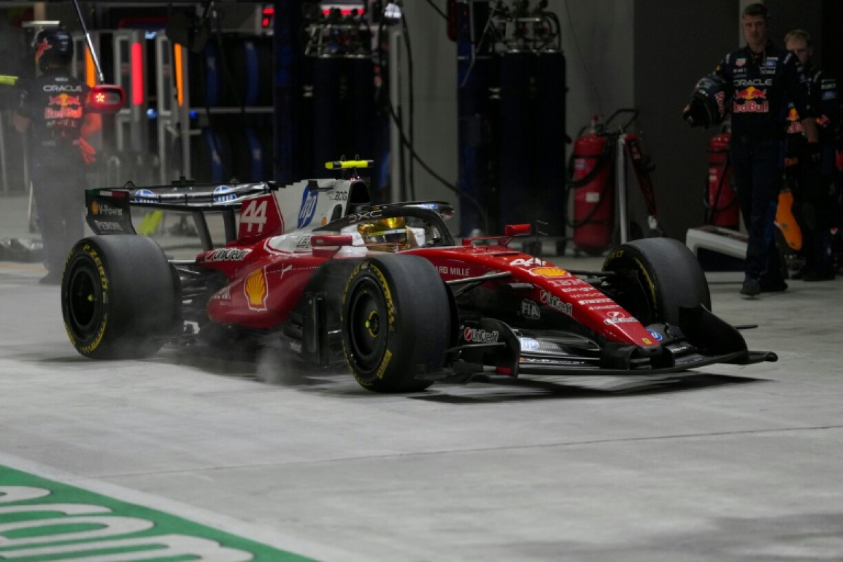 Ferrari's British driver Lewis Hamilton in the pit lane during the Singapore Grand Prix