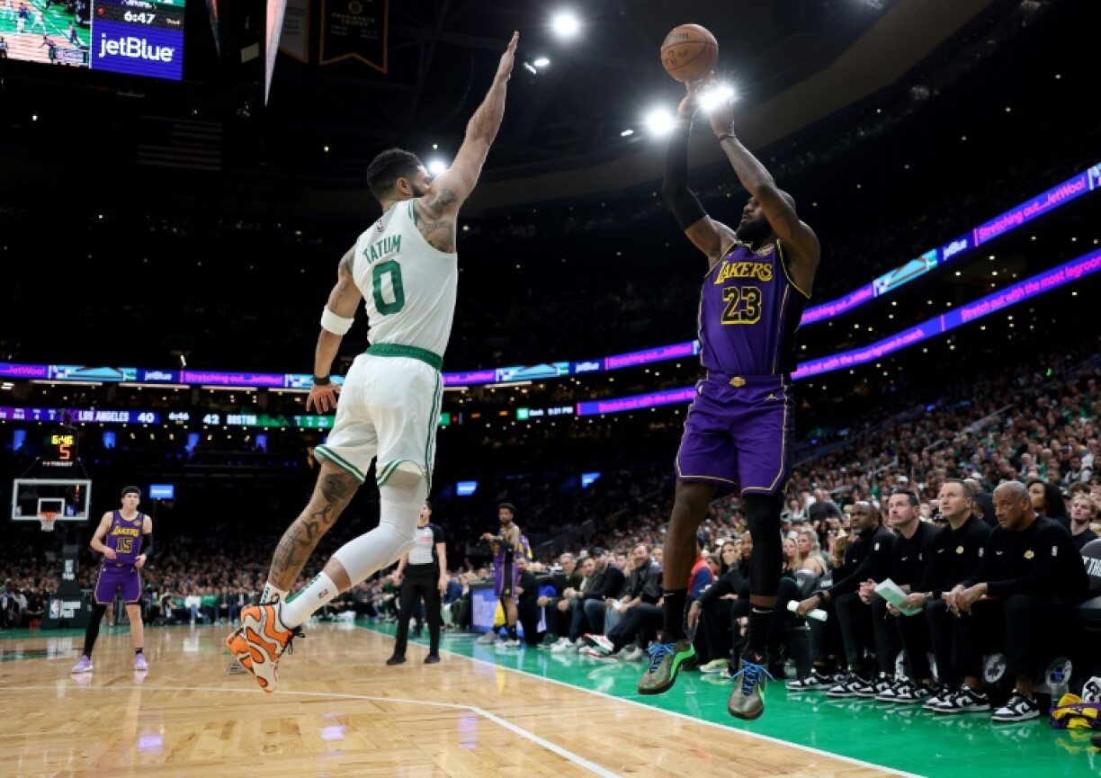 Jayson Tatum (left) attempts to block LeBron James in the Boston Celtics' victory over the Los Angeles Lakers on Saturday
