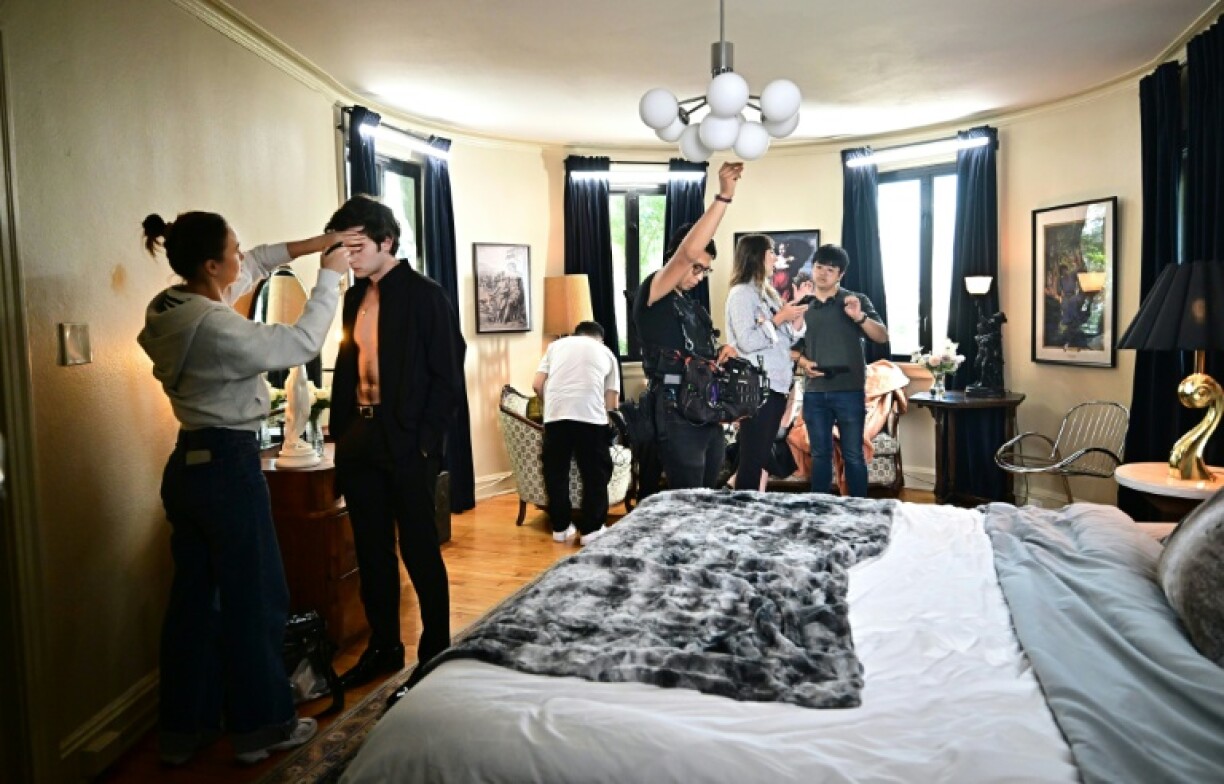 Ukraine-born actor Zachary Shadrin, second from left, gets a final makeup check before a bedroom scene in the vertical drama 'Love Through All Seasons'