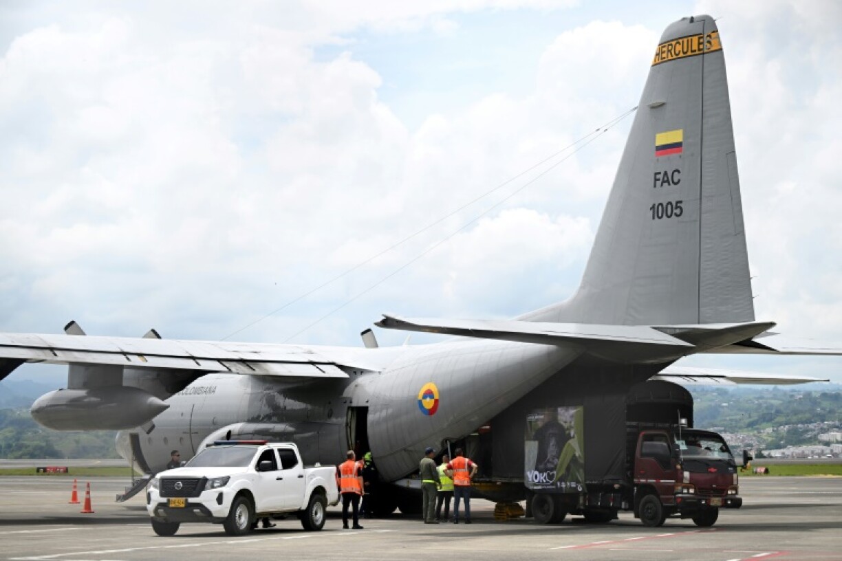 Yoko's crate being loaded into a Colombian Air Force plane