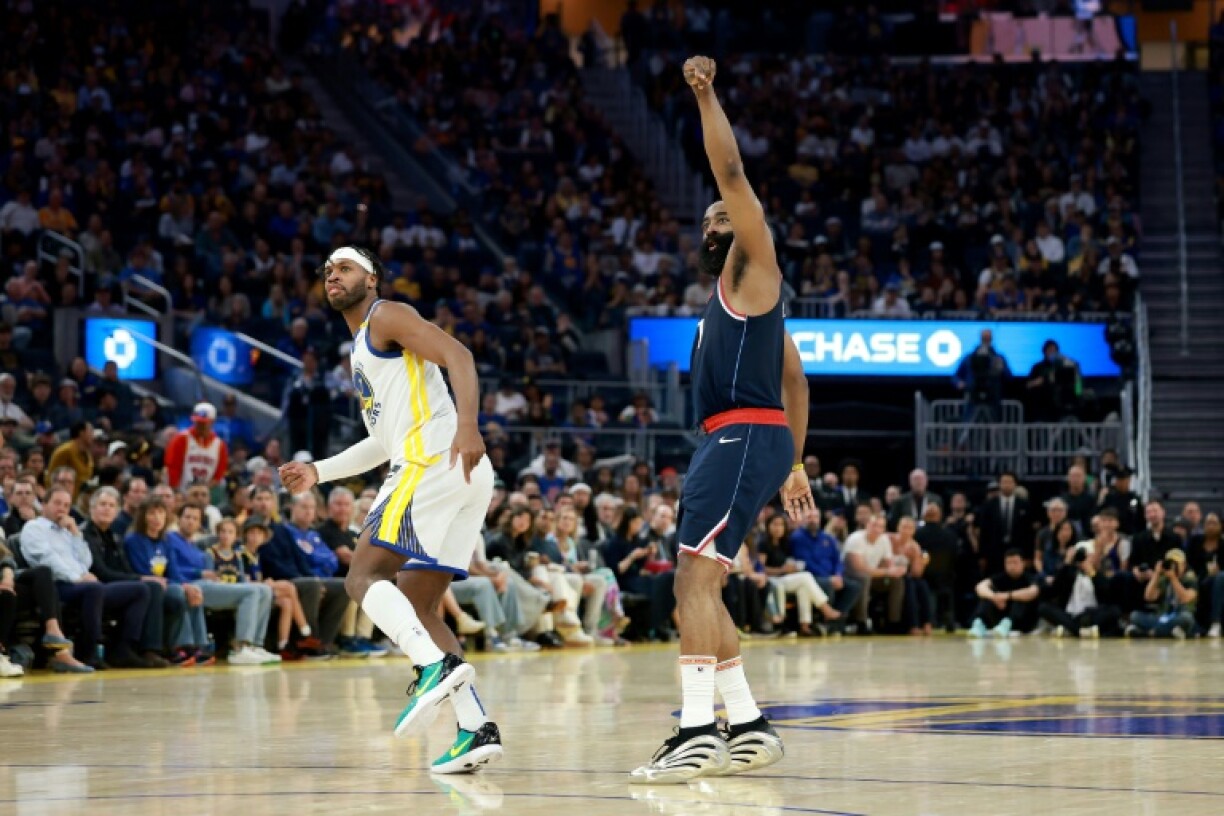 James Harden (right) makes a basket in the Los Angeles Clippers win over the Golden State Warriors