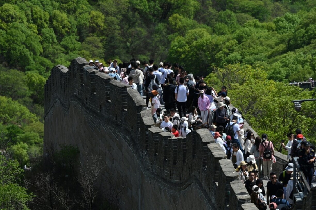 Two Japanese tourists in their 20s were detained for two weeks in China then deported for taking photos showing exposed buttocks at the Great Wall