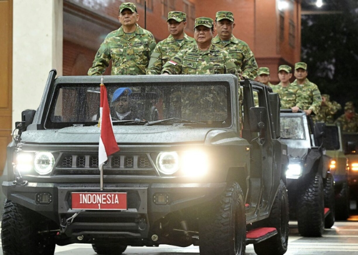 Indonesia's President Prabowo Subianto (3L) at the military academy during their cabinet retreat in Magelang, Central Java