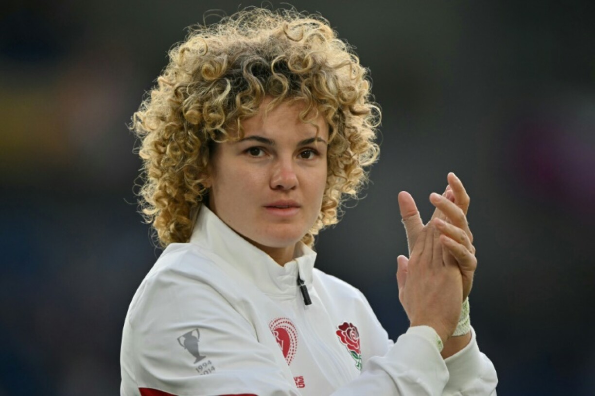 England full-back Ellie Kildunne returns to the pitch after suffering a head injury to applaud fans following the end of a 47-7 Women's Rugby World Cup Pool A win over Australia in Brighton