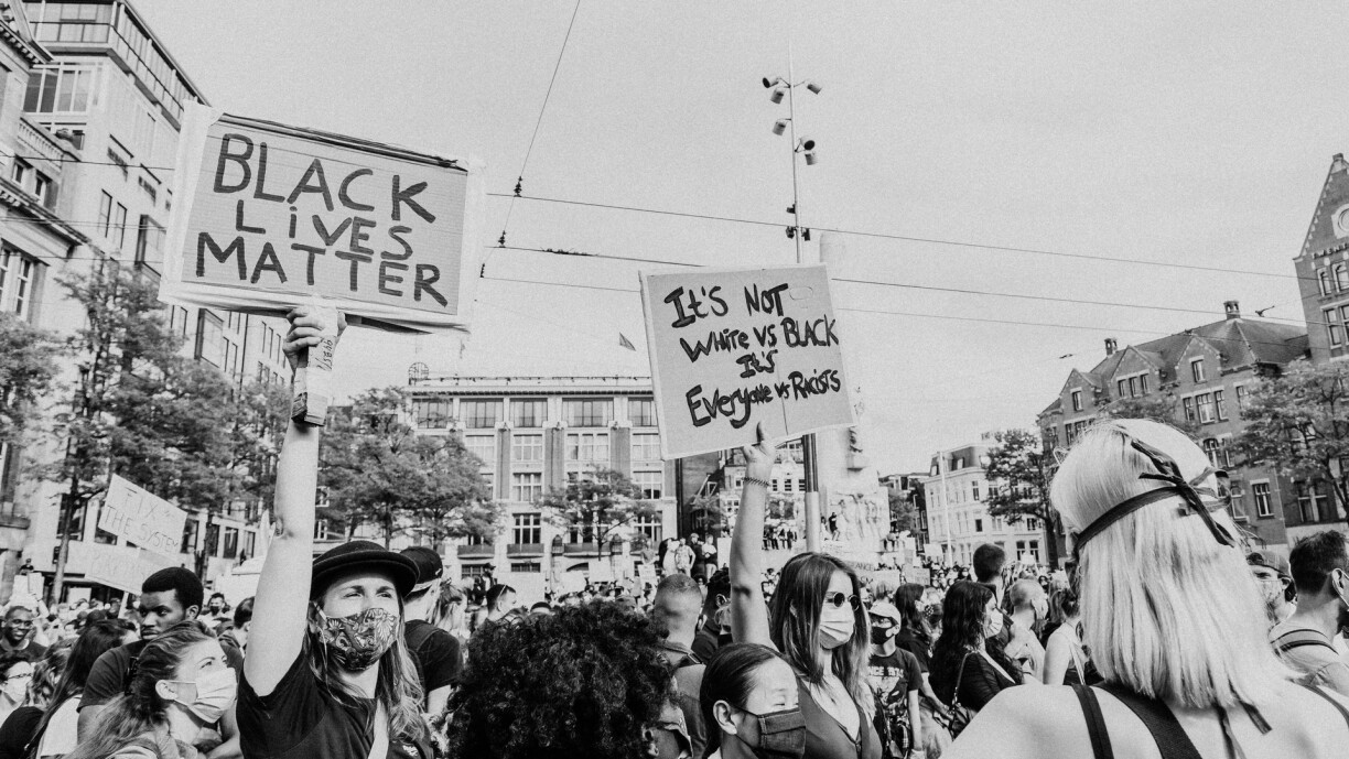Protesters holding signs in Amsterdam