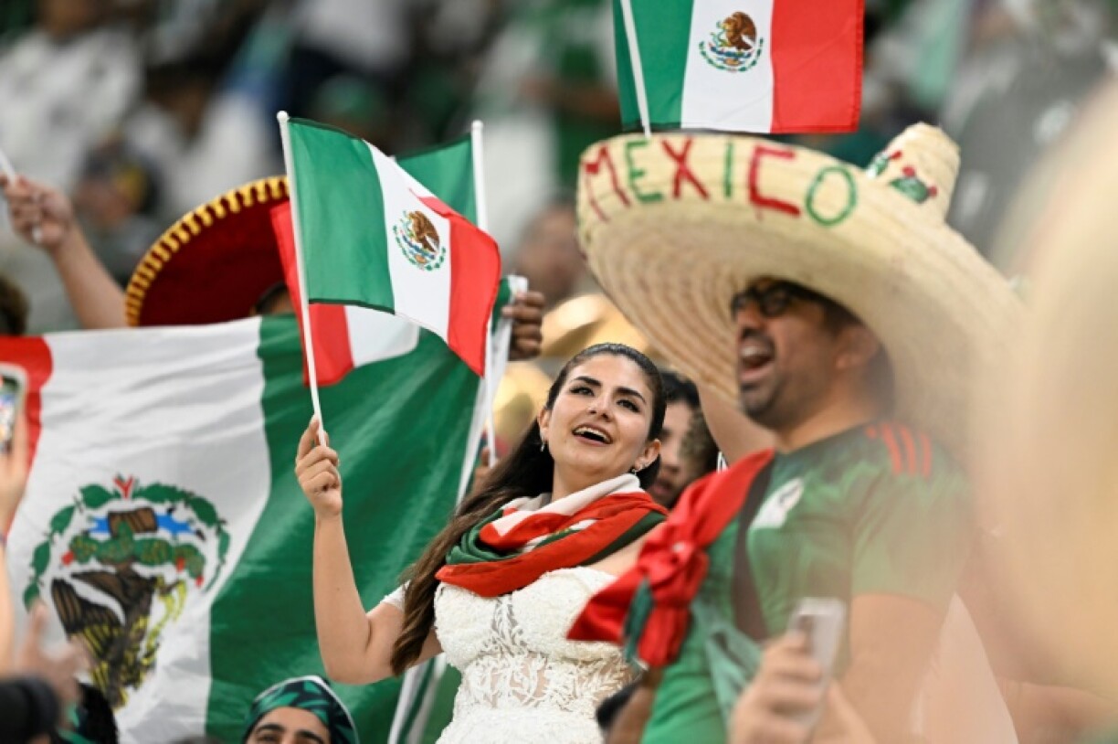 Mexico fans celebrate at the 2022 World Cup; the US government says fans can expect a