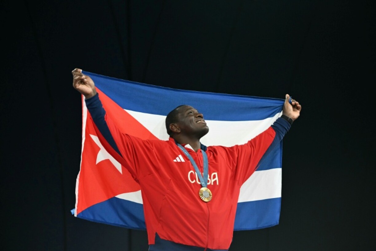 Cuban wrestler Mijain Lopez called for Cuban sport to 'open up' to the world to recover its lost glory
