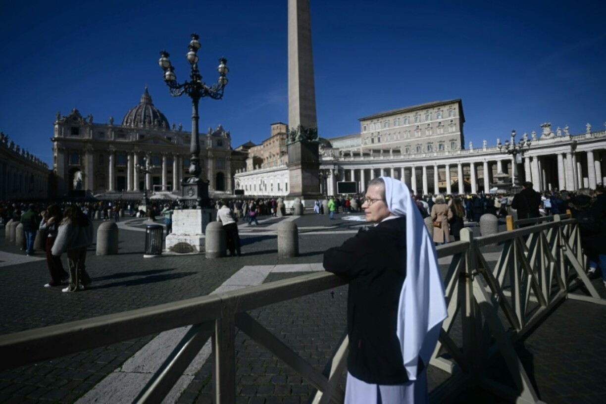 A nun stands in St Peter's Square as Pope Francis is hospitalised for bronchitis and missed his weekly Angelus prayer
