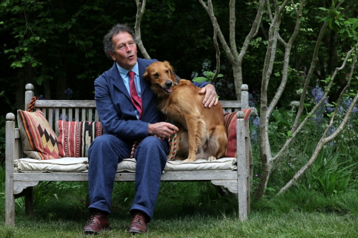 Gardener Monty Don poses with his dog Ned, a golden retriever, in his dog-friendly garden at the RHS Chelsea Flower show