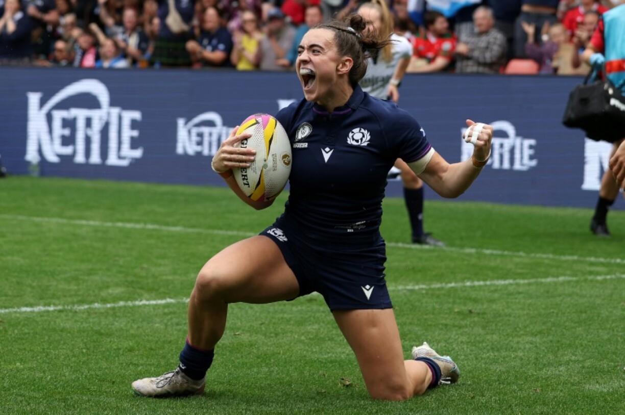 Scotland wing Francesca McGhie celebrates after scoring the team's second try in a 38-8 Women's Rugby World Cup win over Wales in Salford
