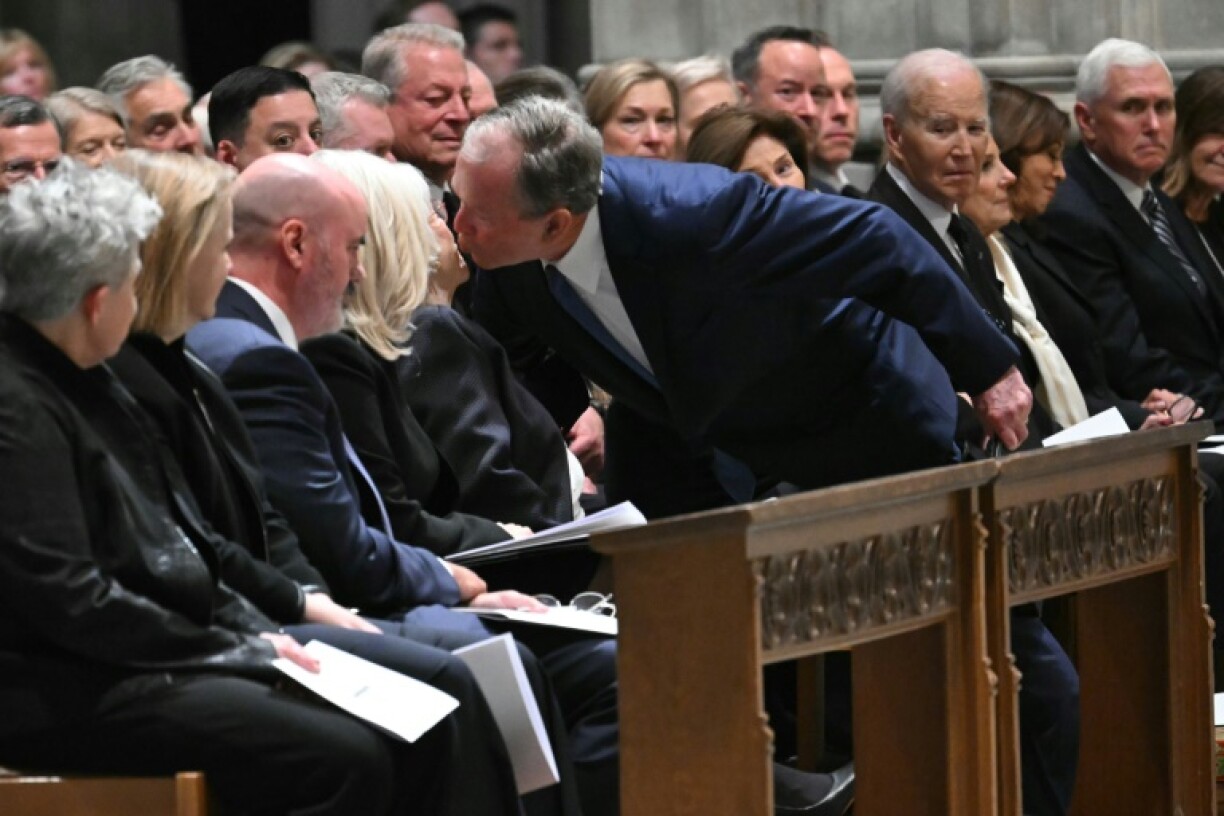 Former US President George W. Bush greets Lynne Cheney, the wife of the late US Vice President Dick Cheney, during his funeral service at the Washington National Cathedral in Washington, DC, on November 20, 2025