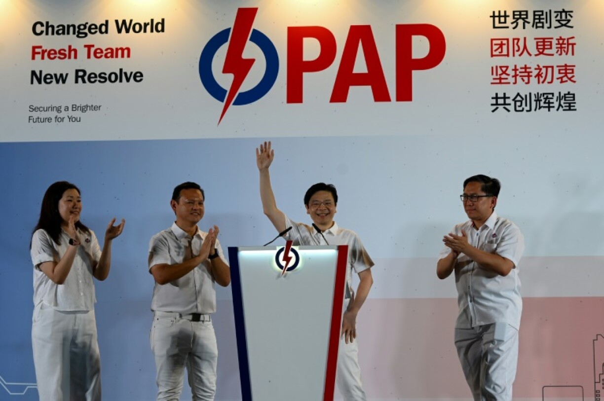 Singapore Prime Minister Lawrence Wong of the People's Action Party (PAP) waves to supporters as he celebrates a resounding election victory