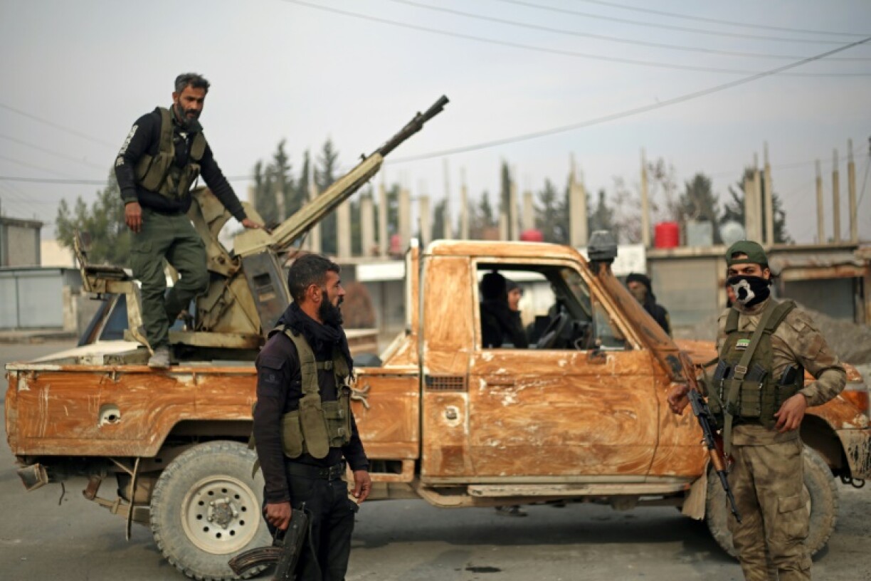 Fighters affiliated with the Turkish-backed Syrian National Army faction patrol in the Manbij region of Syria's Aleppo province on January 4, 2025