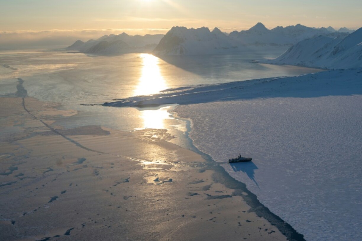 The Kronprins Haakon icebreaker carrying the scientists near Spitzbergen and its glaciers