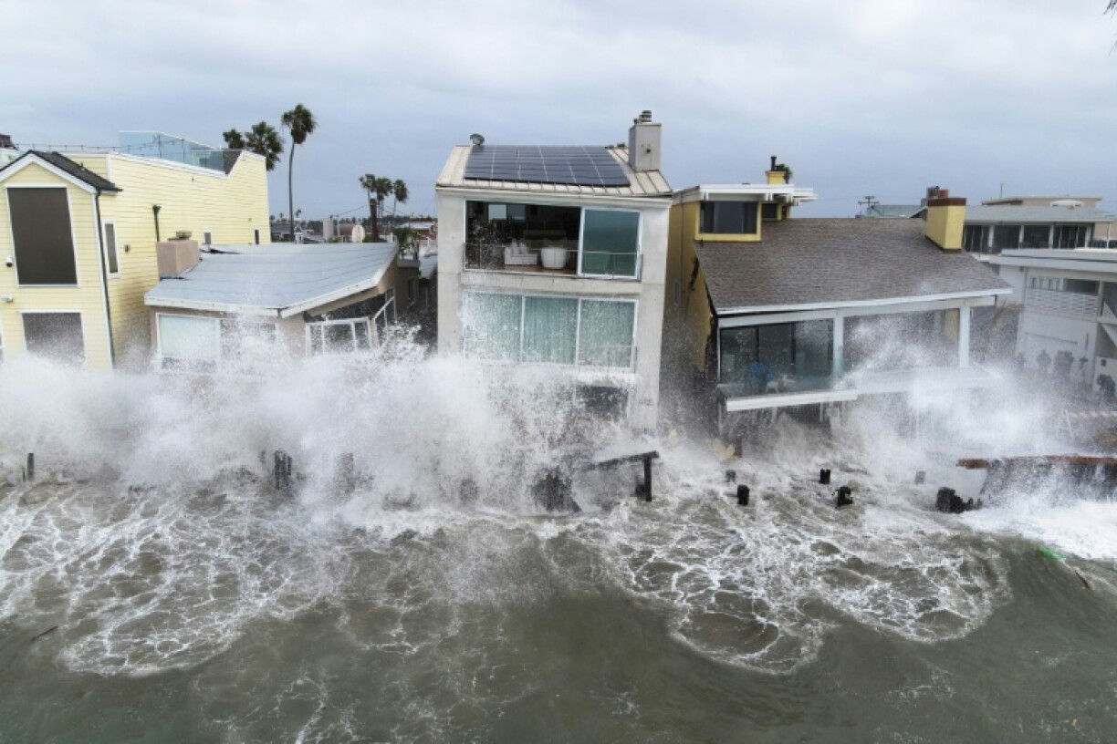 Storm waves created due to Tropical Storm Rachel crash into the boardwalk and homes in Long Beach, California, on October 11, 2026
