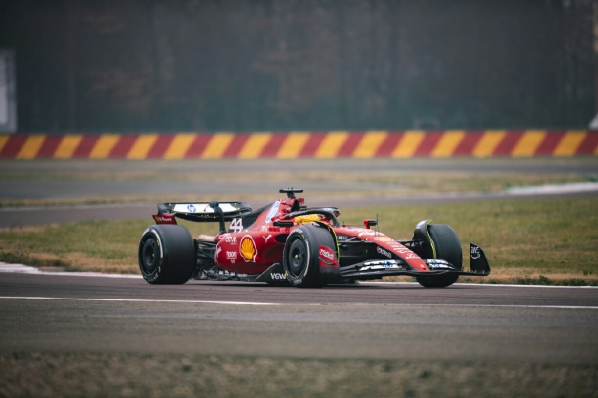 First time: This handout picture released by Ferrari shows Lewis Hamilton testing the Ferrari F1SF 75 on the Fiorano circuit