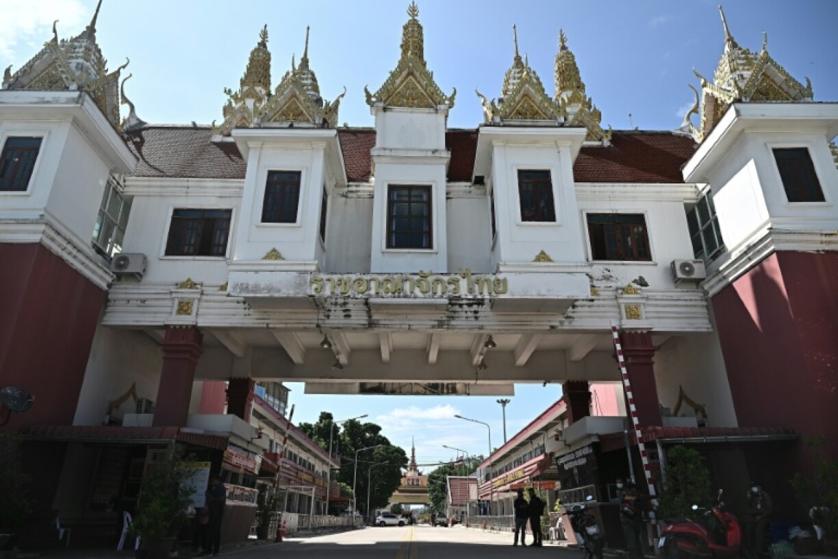Riot police were stationed near the crossing point as people trudged back towards the Thai side after being turned away
