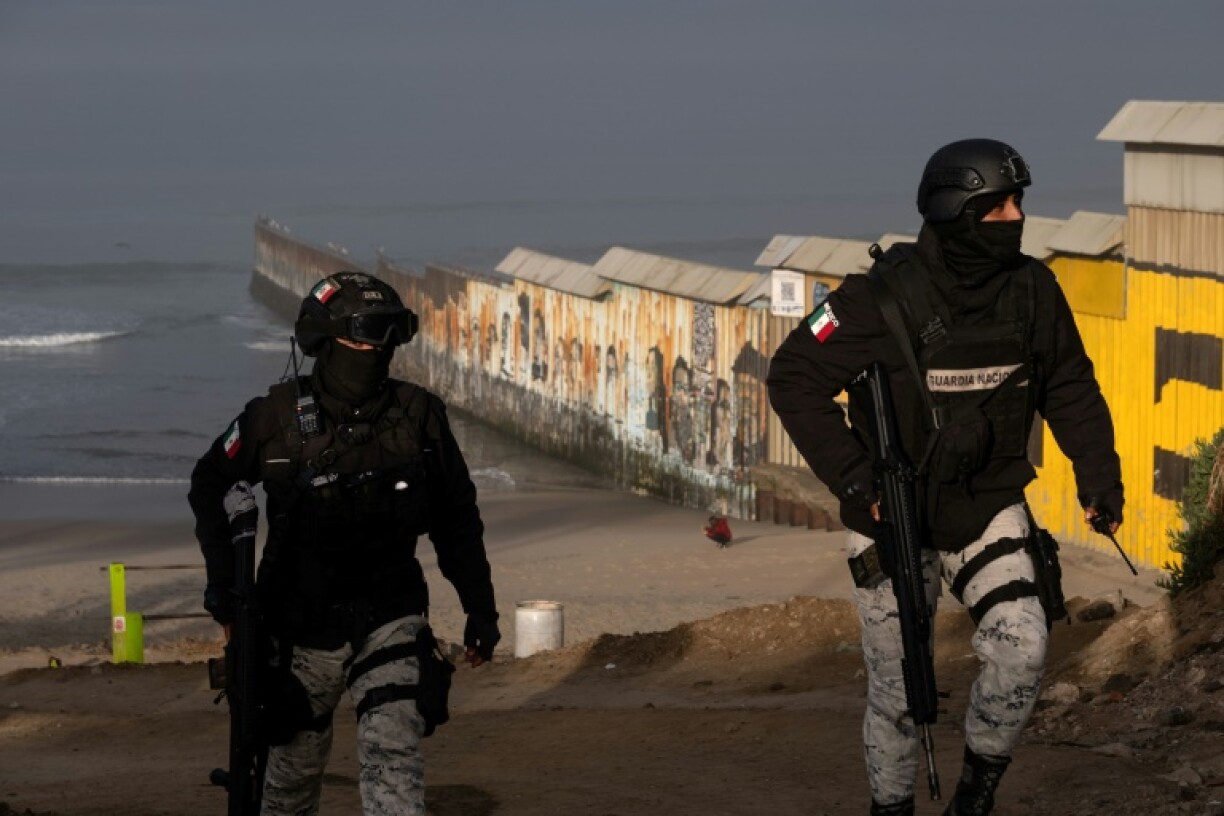 Members of Mexico's National Guard patrol near the border with the United States in Tijuana, just south of California