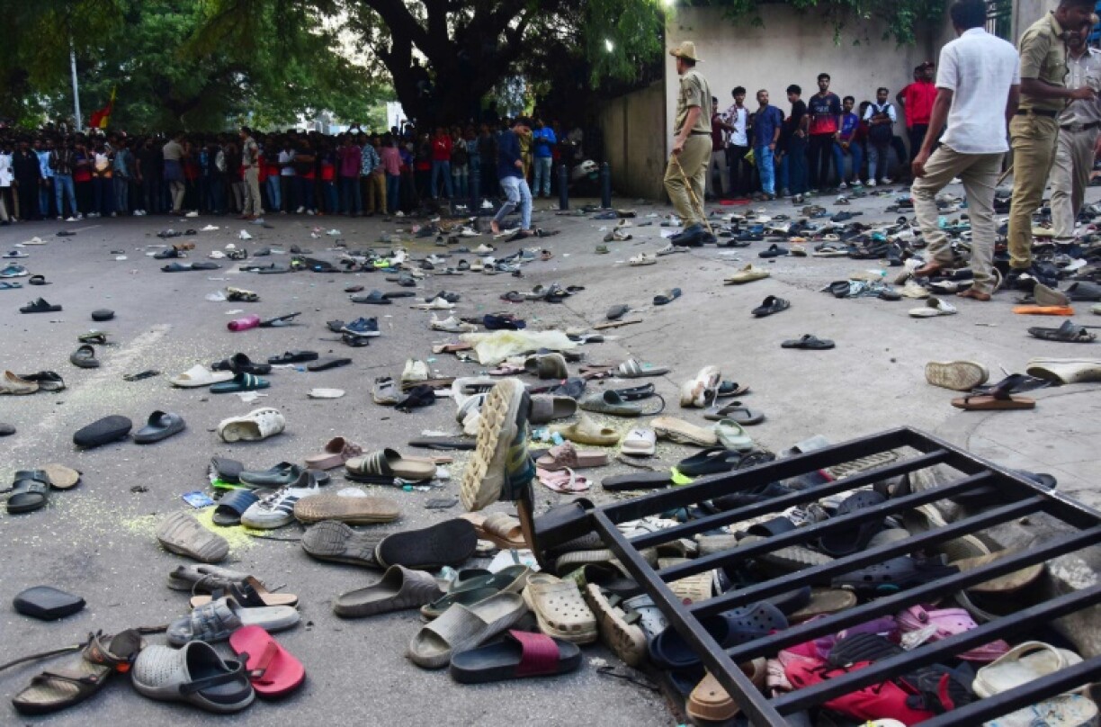 Abandoned shoes and a fallen barrier outside the Chinnaswamy Stadium in Bengaluru after a crush killed 11 people celebrating their team's IPL victory