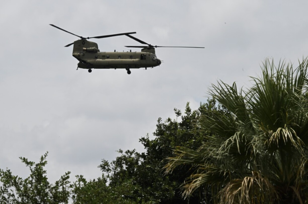 A helicopter flies overhead looking for missing people in Kerrville, Texas