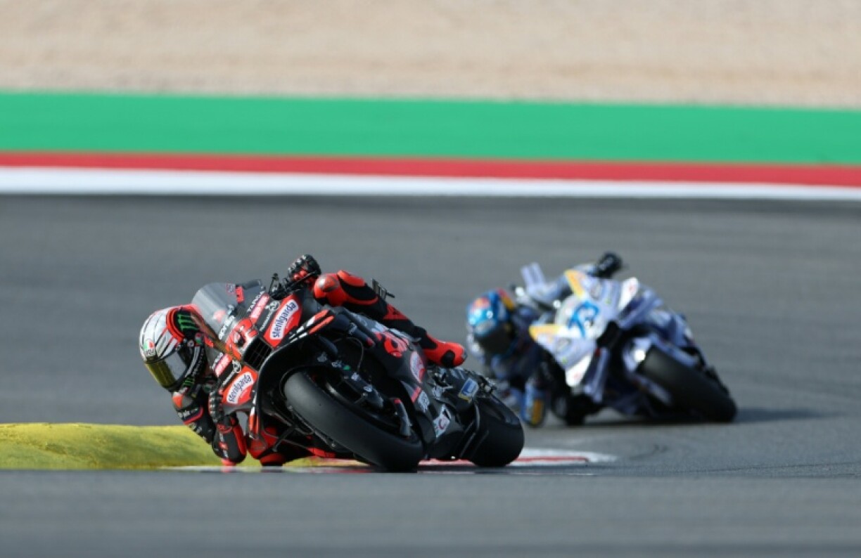 Marco Bezzecchi (L) leads Alex Marquez on his way to victory in the Portuguese MotoGP