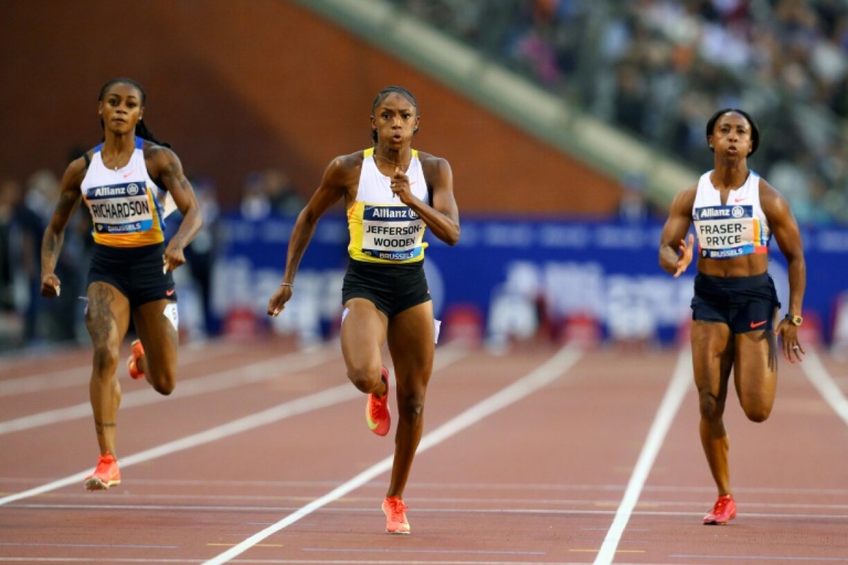 US sprinter Melissa Jefferson-Wooden (C) takes victory in the women's 100m at the Brussels Diamond League meet